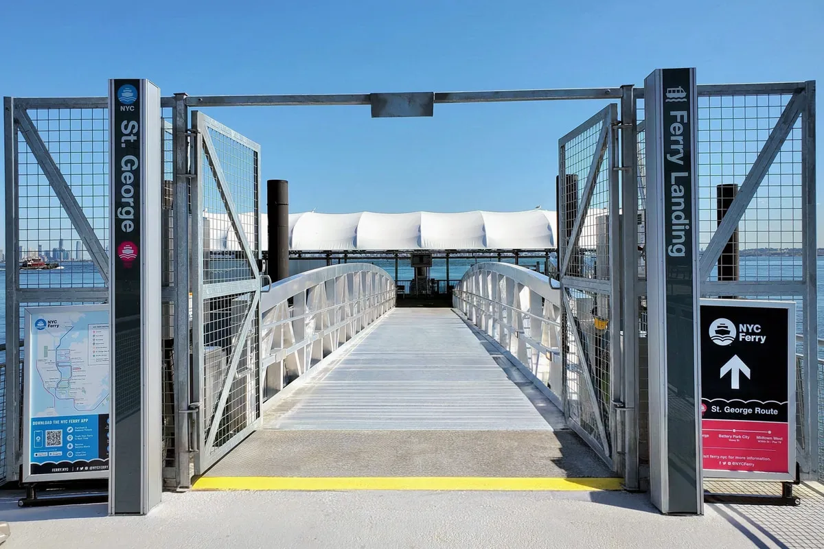 Entry gate at the St. George ferry landing with signage, Staten Island.